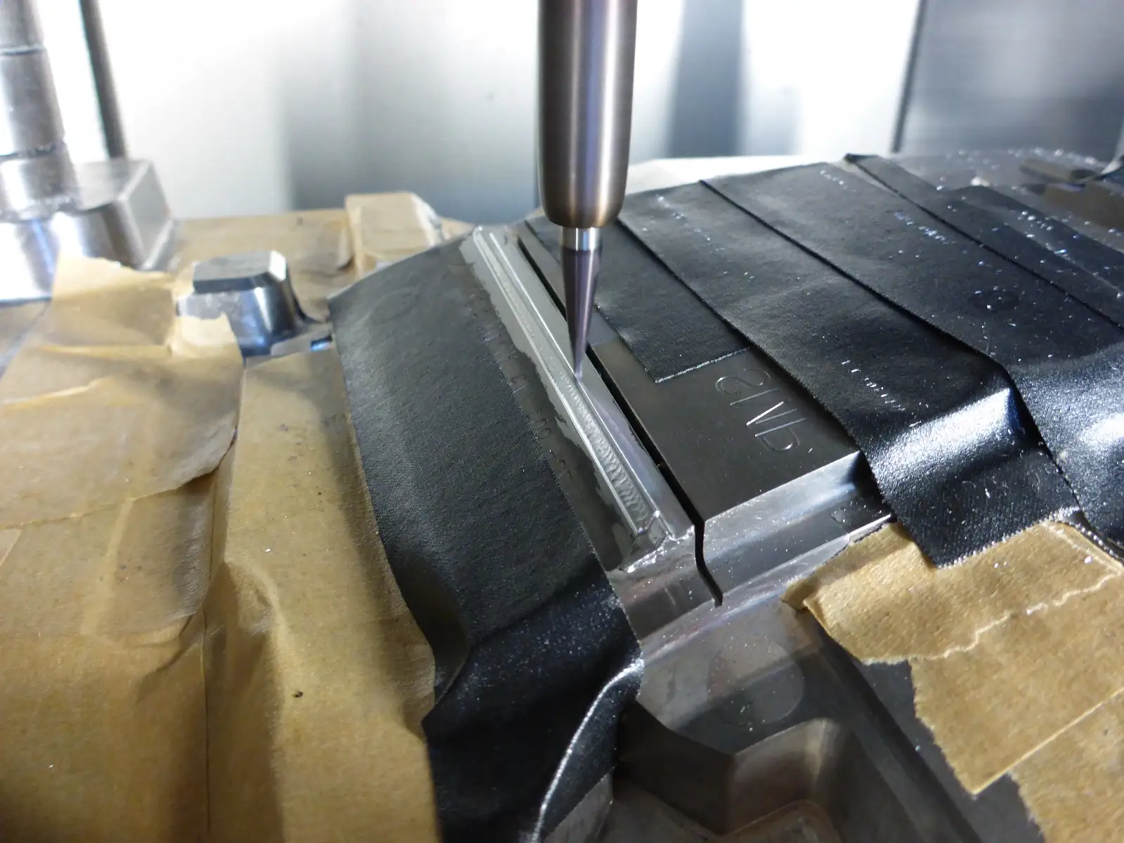 Bearbeitung eines aufgeschweißten und reparierten Formbereichs